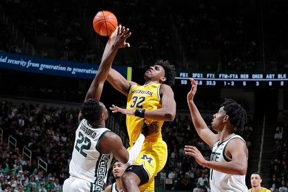 Tarris Reed Jr. (32) and Jaelin Llewellyn (3)