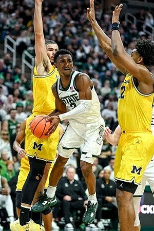 Olivier Nkamhoua (13) and Tarris Reed Jr. (32)