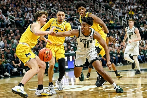 Will Tschetter (42), Jaelin Llewellyn (3), and Tarris Reed Jr. (32)