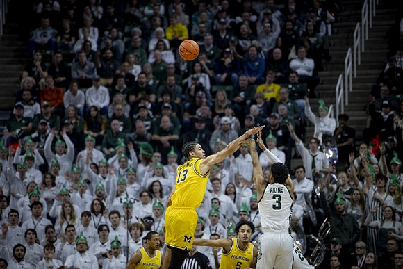 Nimari Burnett (4), Terrance Williams II (5), and Olivier Nkamhoua (13)