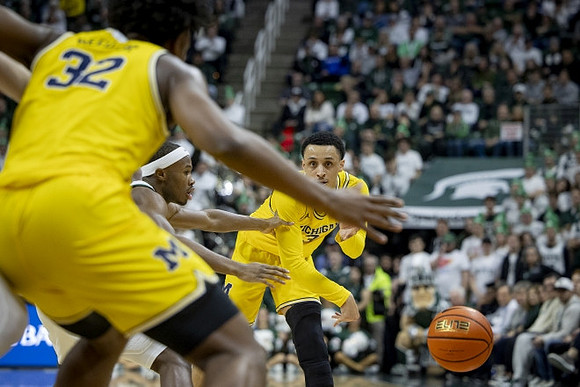 Tarris Reed Jr. (32) and Jaelin Llewellyn (3)