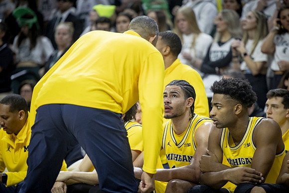 Juwan Howard, Olivier Nkamhoua (13), and Jace Howard (25)