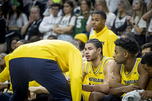 Juwan Howard, Olivier Nkamhoua (13), and Jace Howard (25)