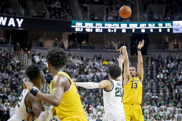 Tarris Reed Jr. (32) and Olivier Nkamhoua (13)
