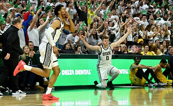 Michigan State Head Coach Tom Izzo, Tray Jackson (2), and Nimari Burnett (4)