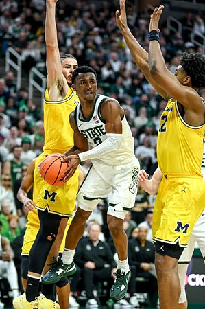 Olivier Nkamhoua (13) and Tarris Reed Jr. (32)