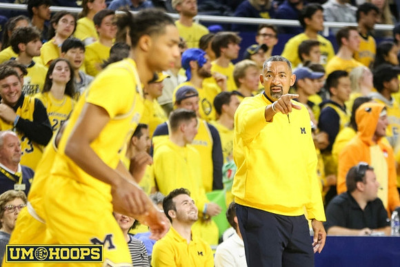 Jett Howard (13) and Juwan Howard