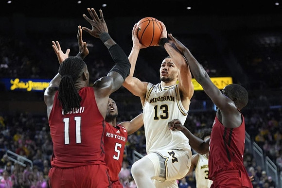 Olivier Nkamhoua (13) and Tarris Reed Jr. (32)
