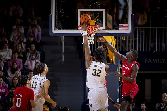 Olivier Nkamhoua (13) and Tarris Reed Jr. (32)