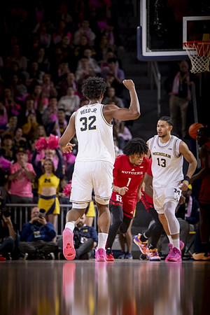 Tarris Reed Jr. (32) and Olivier Nkamhoua (13)