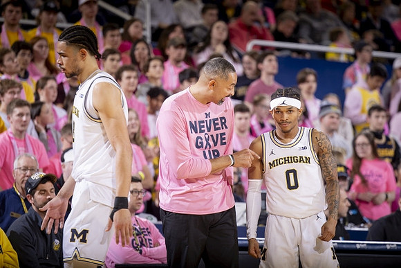 Olivier Nkamhoua (13), Juwan Howard, and Dug McDaniel (0)