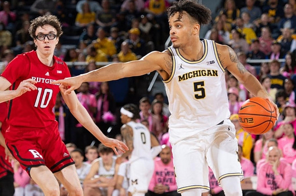 Terrance Williams II (5) and Dug McDaniel (0)