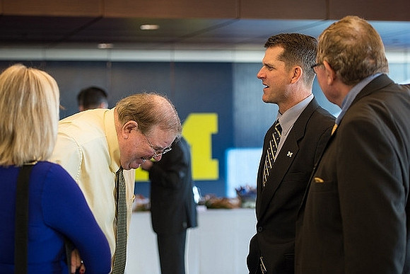Jim Brandstatter, Jim Harbaugh, and Jon Falk