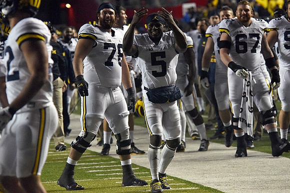 Erik Magnuson (78), Jabrill Peppers (5), and Kyle Kalis (67)