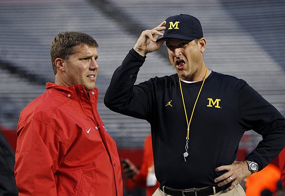 Rutgers Head Coach Chris Ash and Jim Harbaugh