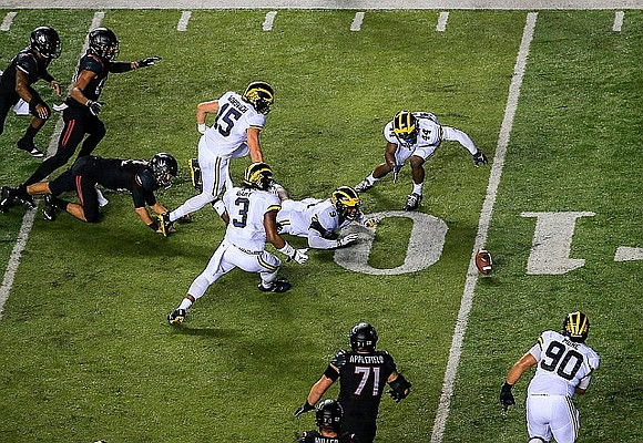 Chase Winovich (15), Rashan Gary (3), Mike McCray (9), Delano Hill (44), and Bryan Mone (90)