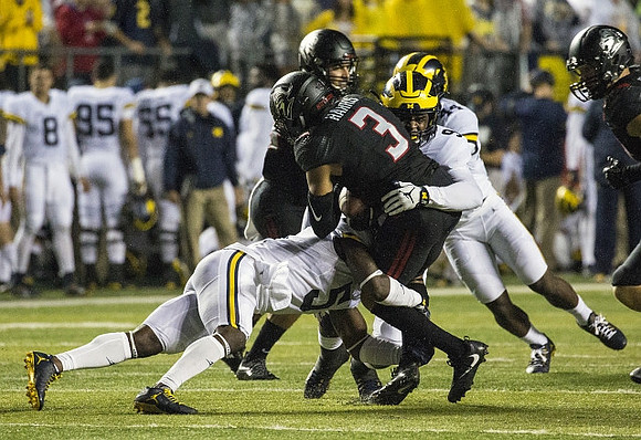 Jabrill Peppers (5), Mike McCray (9), and Delano Hill (44)
