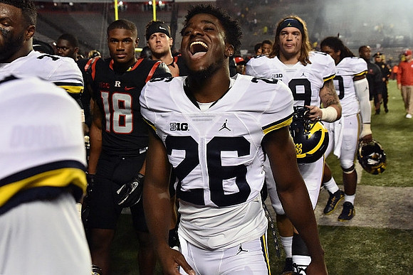 Jourdan Lewis (26) and Henry Poggi (19)