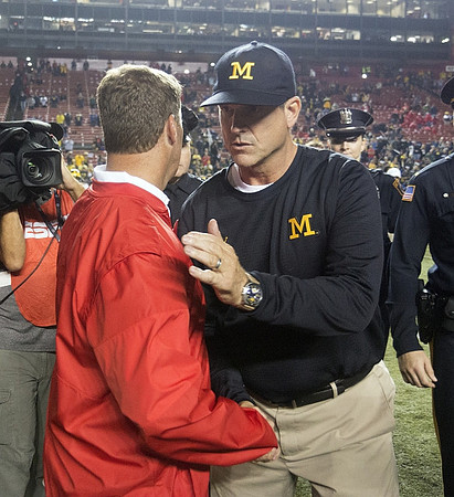 Rutgers Head Coach Chris Ash and Jim Harbaugh