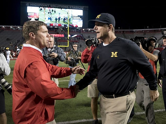 Rutgers Head Coach Chris Ash and Jim Harbaugh