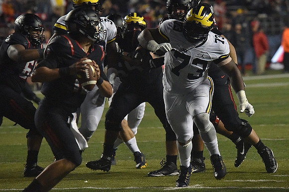 Rashan Gary (3) and Maurice Hurst (73)