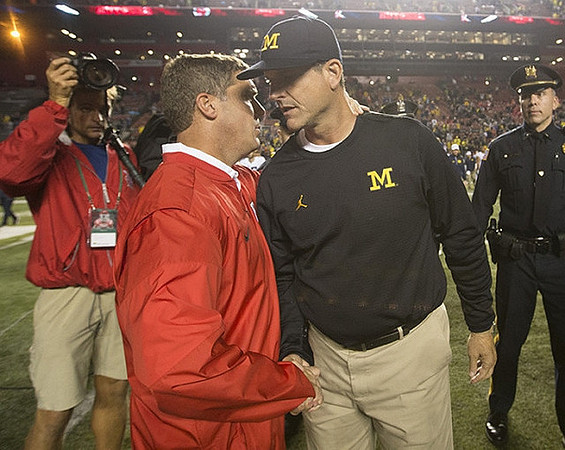 Rutgers Head Coach Chris Ash and Jim Harbaugh