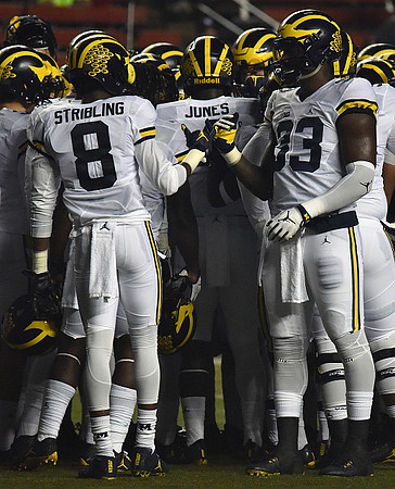 Channing Stribling (8), Reuben Jones (4), and Taco Charlton (33)