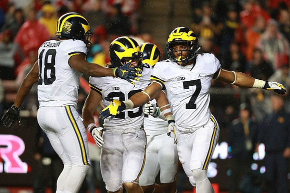 AJ Pearson (18), Tyree Kinnel (23), and Khaleke Hudson (7)