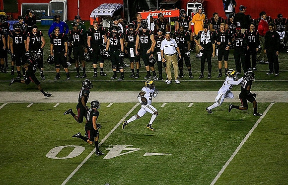 Jabrill Peppers (5) and Amara Darboh (82)
