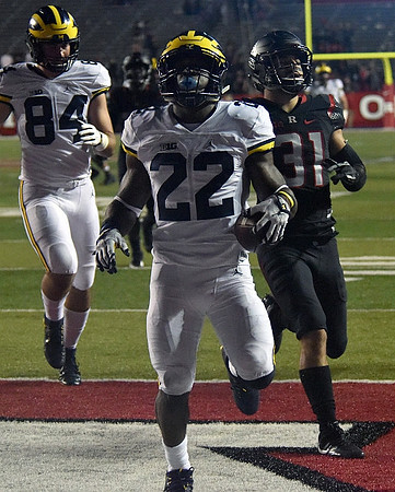 Sean McKeon (84) and Karan Higdon (22)