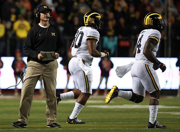 Jim Harbaugh, Khalid Hill (80), and De'Veon Smith (4)