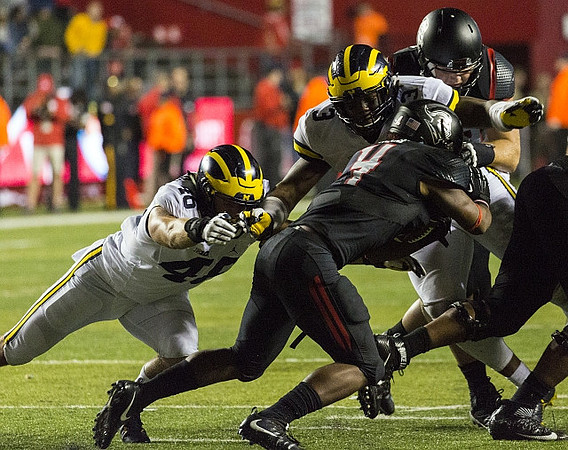 Michael Wroblewski (46) and Rashan Gary (3)