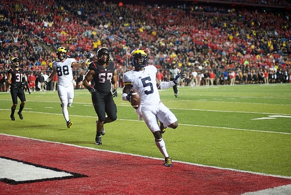 Jake Butt (88) and Jabrill Peppers (5)