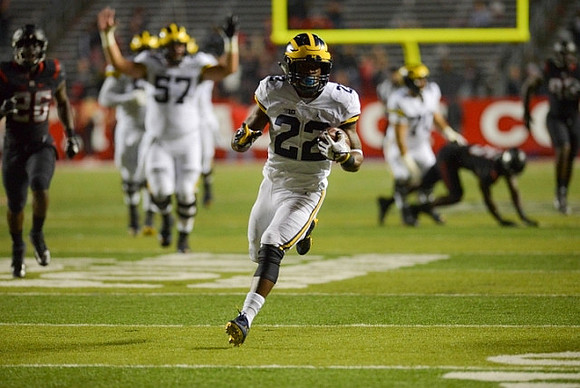 Patrick Kugler (57) and Karan Higdon (22)