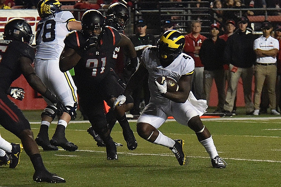 Erik Magnuson (78) and De'Veon Smith (4)
