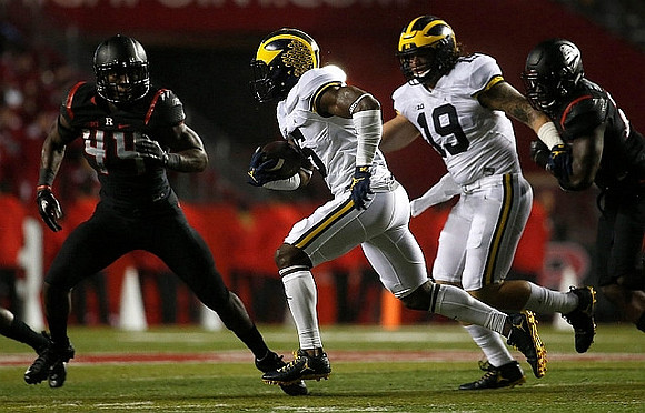 Jabrill Peppers (5) and Henry Poggi (19)