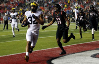Jake Butt (88), Ty Isaac (32), and Kyle Kalis (67)