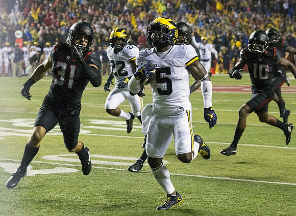 Jabrill Peppers (5), Karan Higdon (22), and Wilton Speight (3)