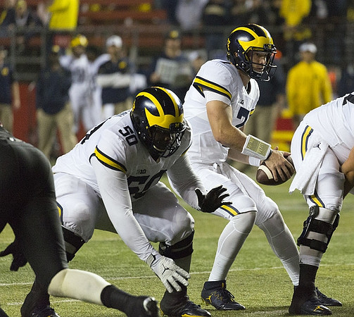 Michael Onwenu (50) and Shane Morris (7)