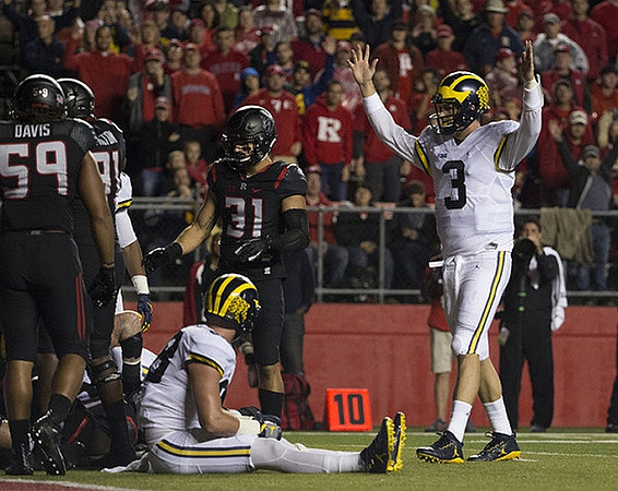 Jake Butt (88) and Wilton Speight (3)