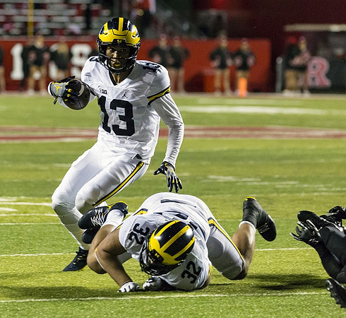 Eddie McDoom (13) and Ty Isaac (32)