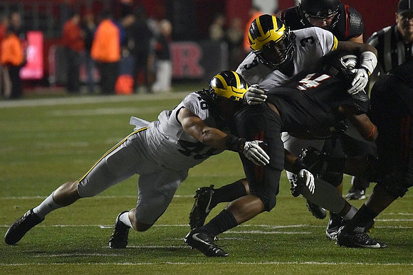Michael Wroblewski (46) and Rashan Gary (3)