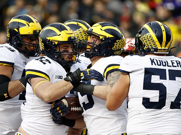 Jon Runyan Jr. (75), Mason Cole (52), Henry Poggi (19), and Patrick Kugler (57)