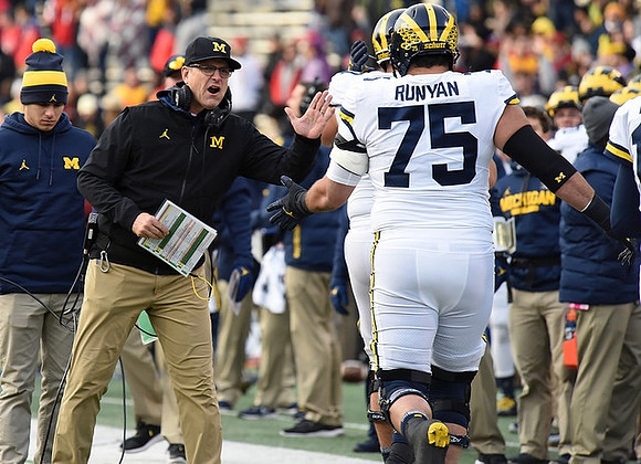 Jim Harbaugh and Jon Runyan Jr. (75)