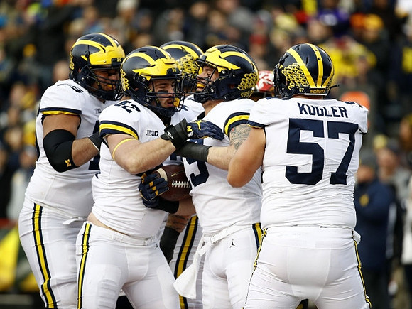 Jon Runyan Jr. (75), Mason Cole (52), Henry Poggi (19), and Patrick Kugler (57)