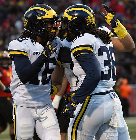 Jaylen Kelly-Powell (16) and Devin Gil (36)