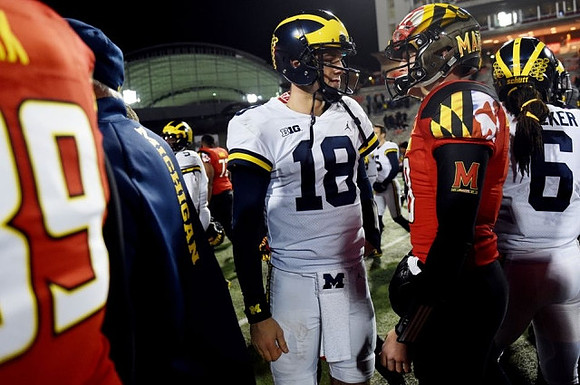 Brandon Peters (18) and Kareem Walker (6)
