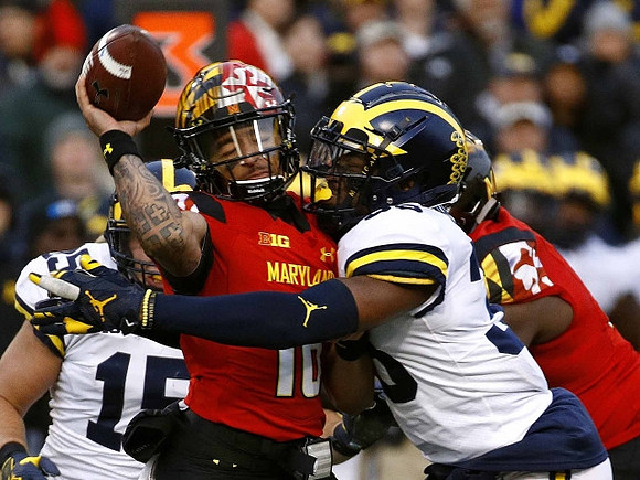 Chase Winovich (15) and Josh Uche (35)