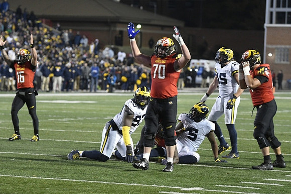 Lawrence Marshall (93), Aubrey Solomon (5), and Chase Winovich (15)