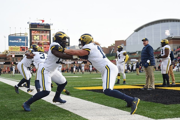 Chase Winovich (15) and Greg Mattison